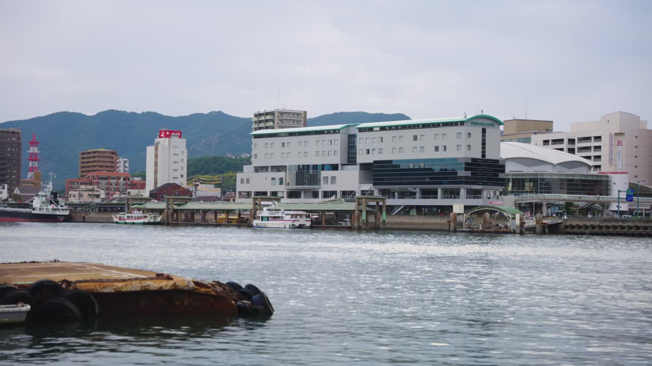 Harbor Cityscape with Boats and Hotel