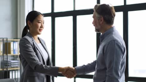 professional handshake symbolizing collaboration and agreement between two business professionals in a modern office setting, highlighting connection and mutual understanding