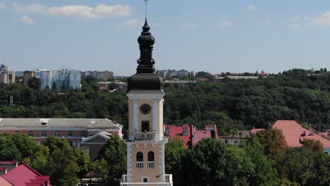 Aerial-View-of-a-Clock-Tower-in-a-Town-in-Ukraine-on-a-Summer-Day
