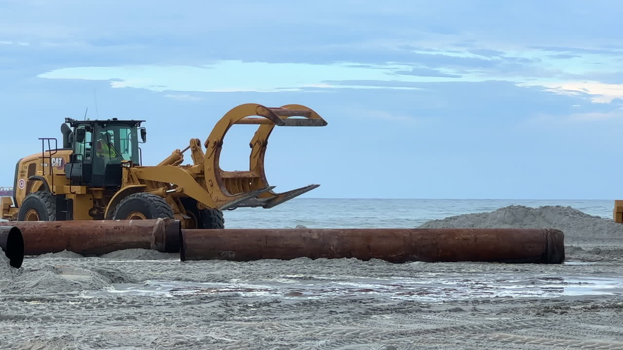 Heavy Machinery on Beach During Construction Project