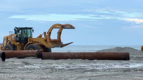 heavy machinery on beach during construction project