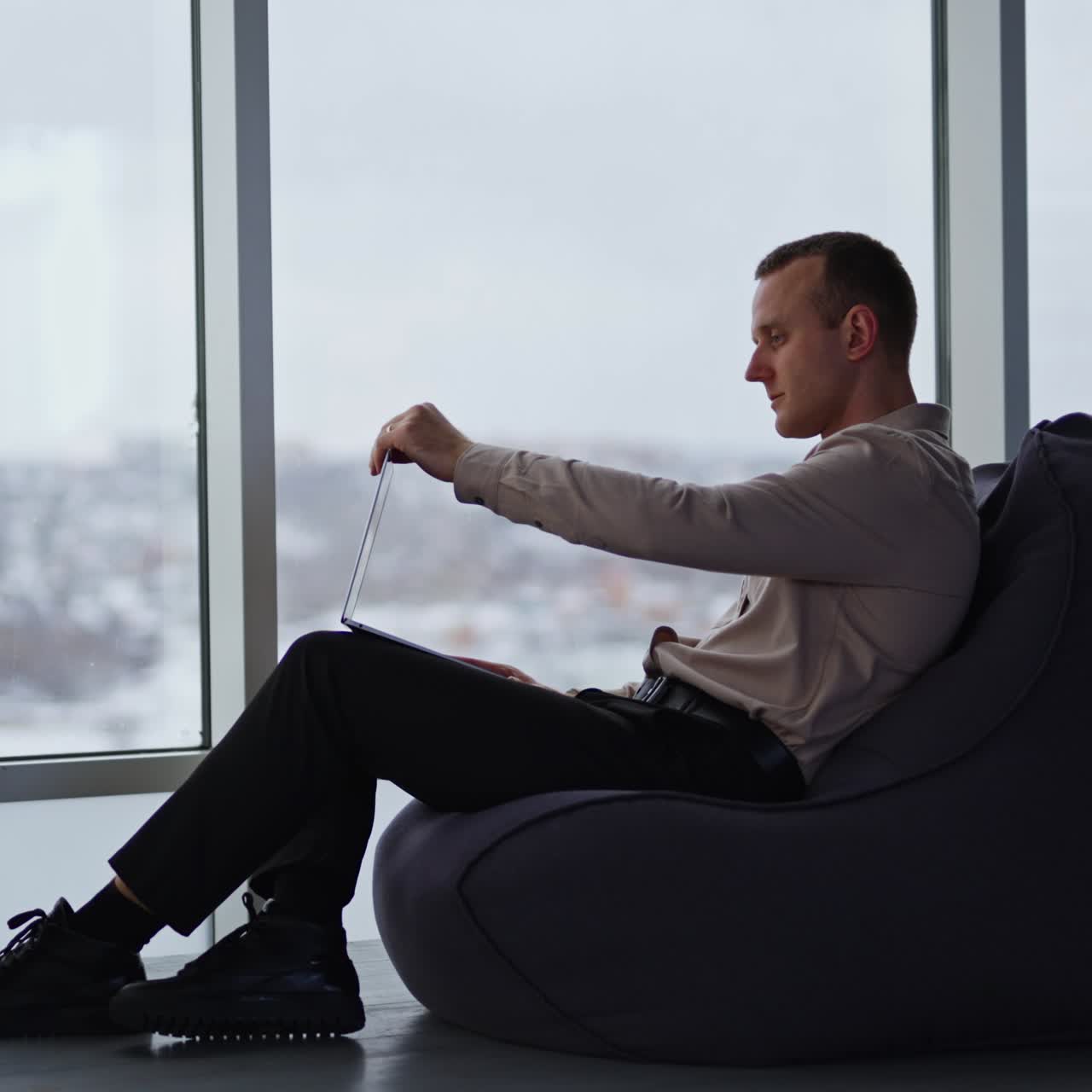 Confident succesfull businessman with phone. Professional business manager working in modern office