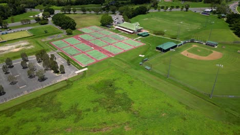 Right-to-left-aerial-over-Firth-park-sporting-grounds,-Mudgeeraba,-Gold-Coast,-Queensland,-Australia