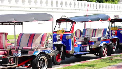 colorful tuk-tuks lined up in bangkok, thailand