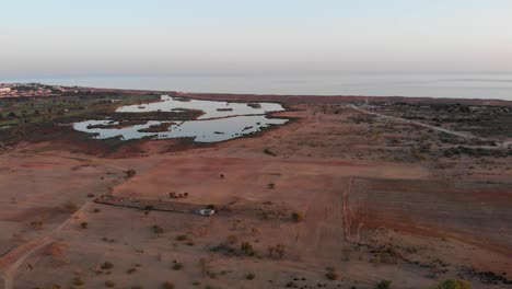 aerial view of the desert in albufeira, portugal with sea in the background