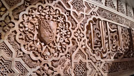 detail shot of part of the decoration on the walls and ceiling of the portico in the court of the myrtles of the nasrid palaces within the monumental alhambra complex in granada, spain