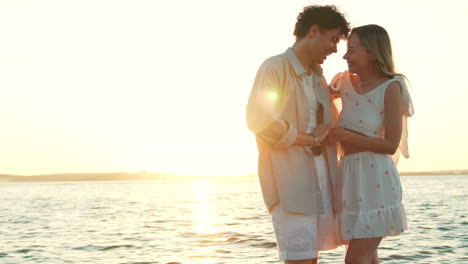 couple enjoying a sunset at the beach