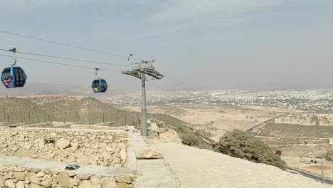 cable car of the aerial tramway connecting oufella peak and agadir city in morocco, overlooking a panoramic view of the beach-22