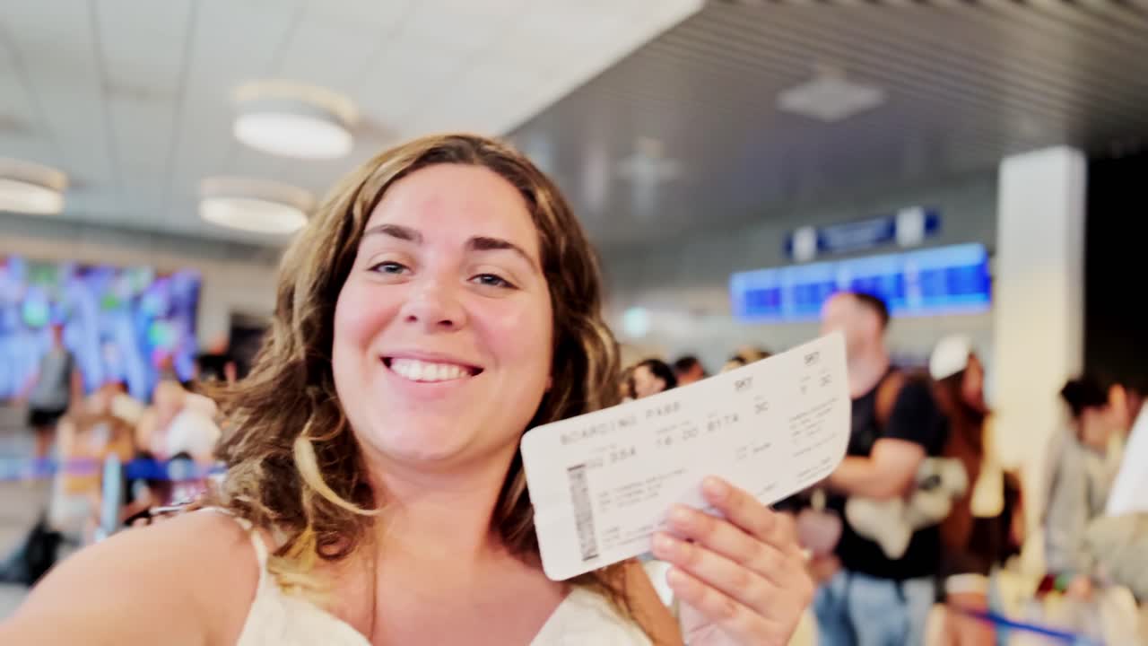 Woman Holding Boarding Pass with Big Smile at Airport