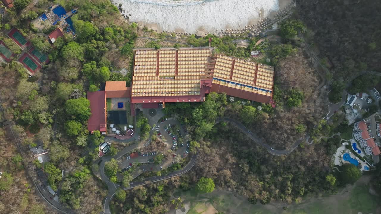 TOP DOWN DRONE SHOT OF LAS BRISAS HOTEL AT IXTAPA ZIHUATANEJO AT SUNSET