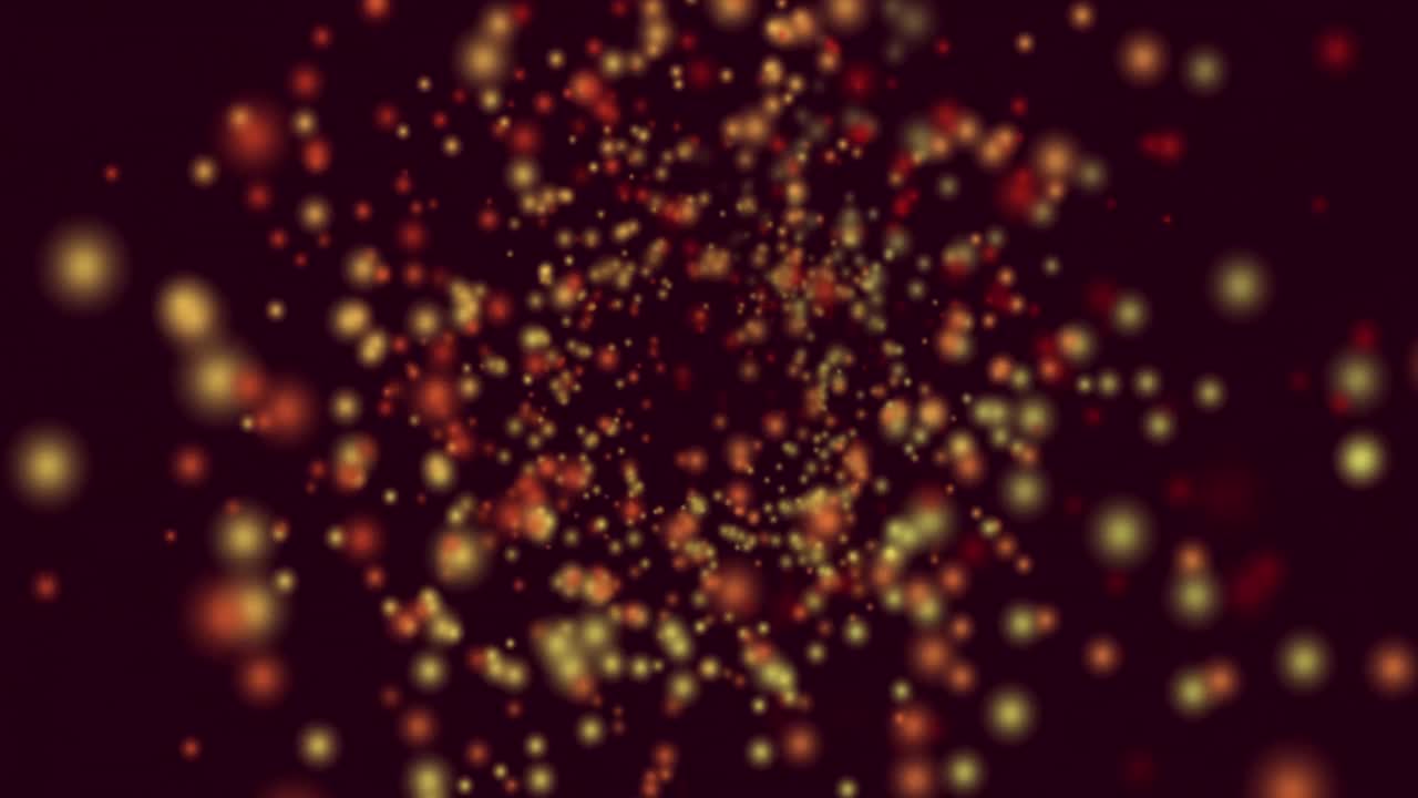 animación de manchas amarillas y rojas de luz volando en movimiento hipnótico sobre fondo negro