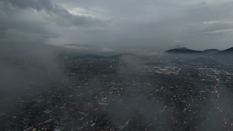 drone flying among clouds above ecatepec, mexico