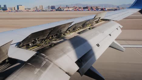 airplane cockpit wing flaps position indicator moving up – close up