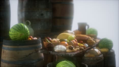 food table with wine barrels and some fruits, vegetables and bread