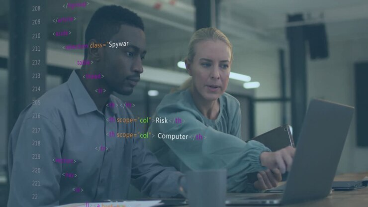 Animation of data processing over diverse colleagues using laptop and tablet in office
