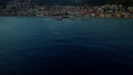 Aerial-cinematic-approach-of-Varazze-city-in-Italy-at-sunset