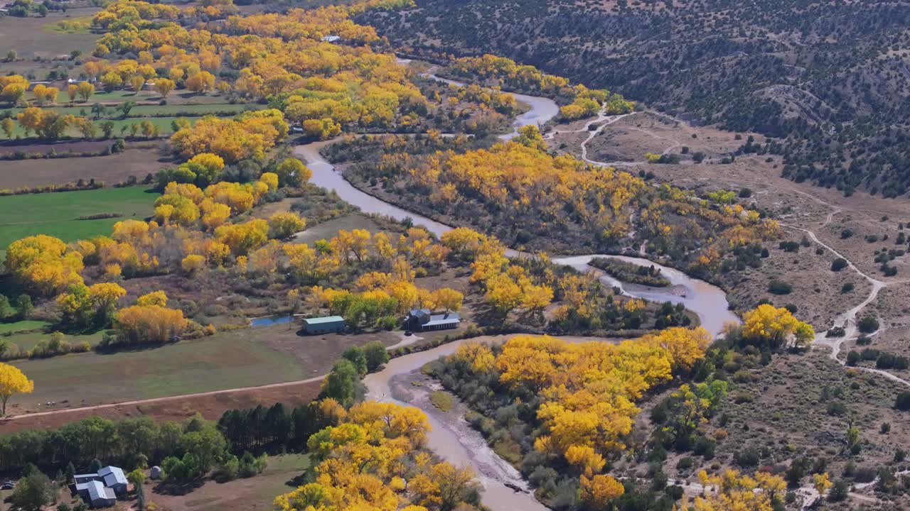 Autumn view of Rio Chama with golden cottonwoods in Abiquiu, New Mexico