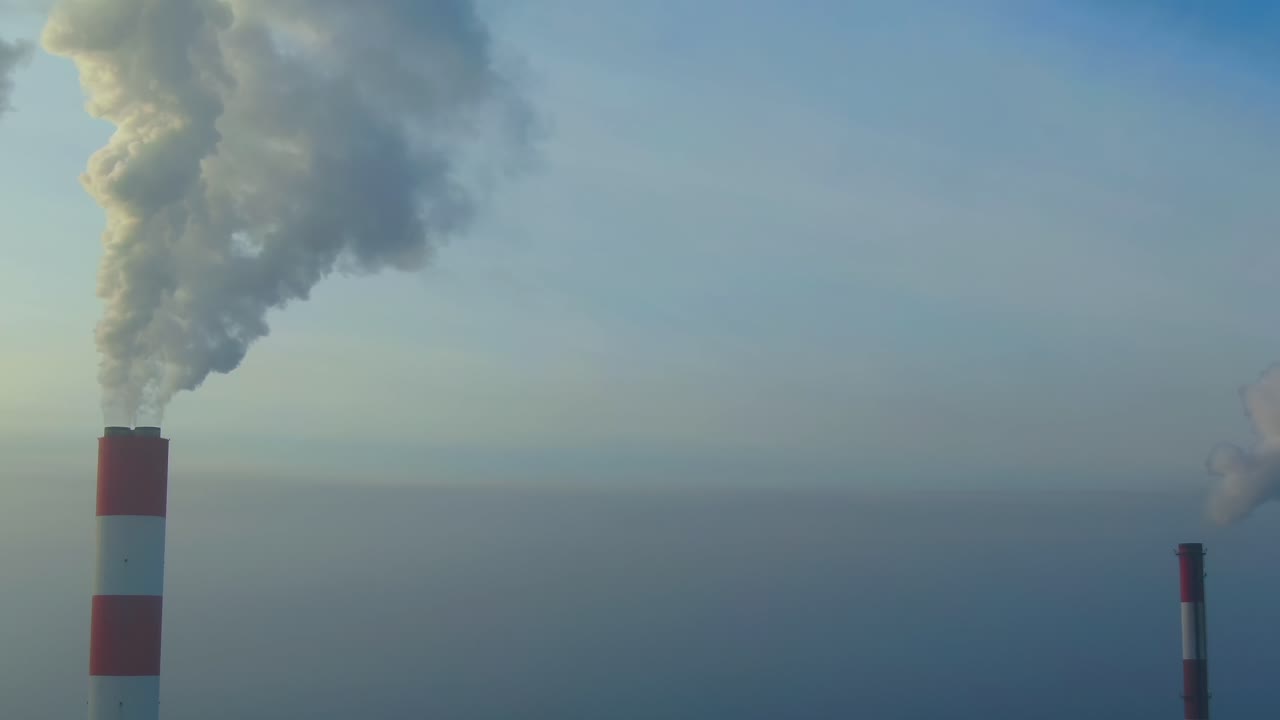 Aerial view of Industrial zone, plants and factories with smoke from chimneys. Air pollution concept