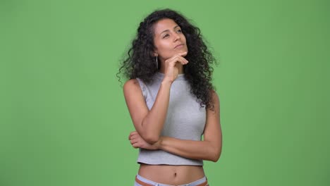 young beautiful hispanic woman thinking