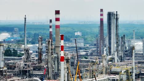 Aerial-drone-view-of-oil-terminal-with-chimneys-in-industrial-facility-for-storage-of-oil-and-petrochemical