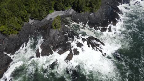 Zenith-view-of-big-waves-crashing-on-rocky-shore-of-botany-bay-from-above