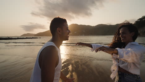 Woman jumping on his boyfriend&#039;s arms