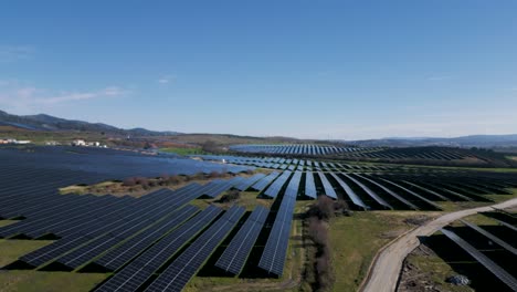 expansive solar farm amidst portuguese landscape - aerial fly-over