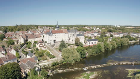 aerial drone point of view of the town of saint gaultier on the banks of the river creuse in indre, france