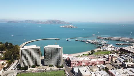 Aerial-Flyover-of-Fisherman's-Wharf-bay-and-Alcatraz-island-on-a-clear-day
