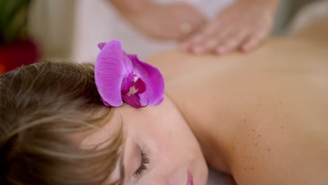 relaxing spa massage with orchid