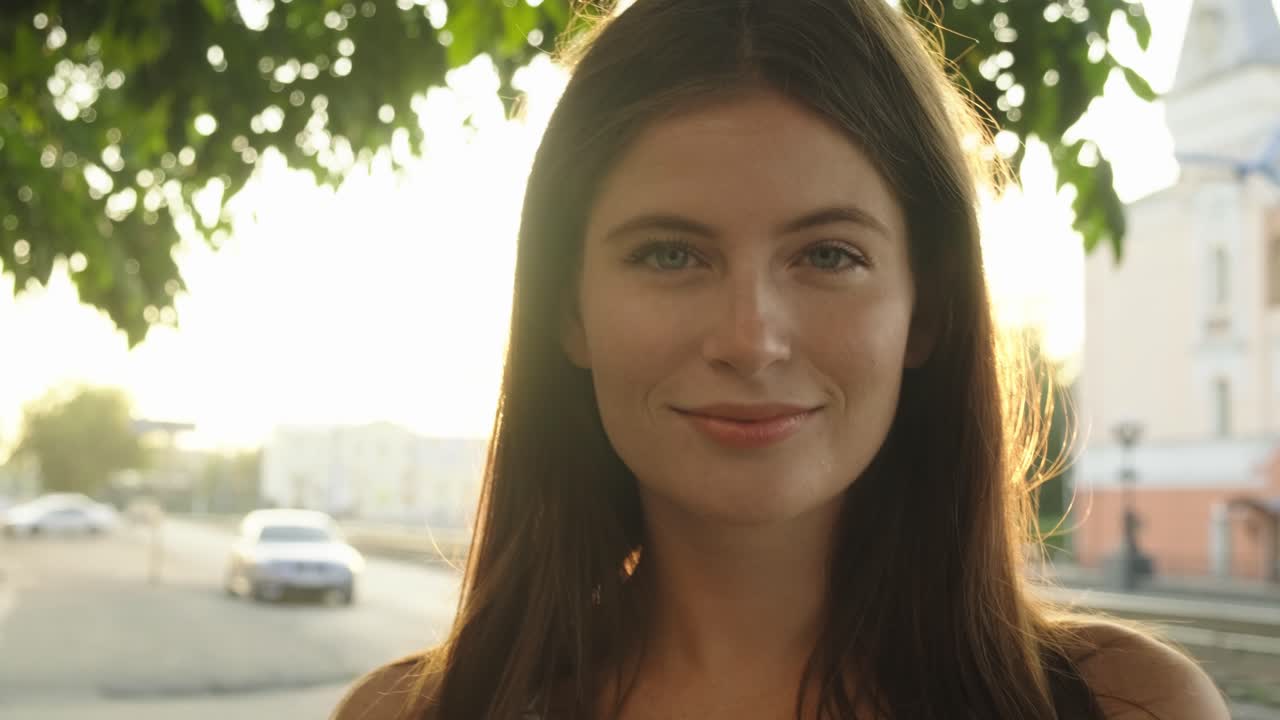 Woman in a city at sunset