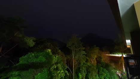 timelapse from the silhouette of the arenal volcano illuminated by flashes of lightning accompanied by a tropical evening storm in costa rica