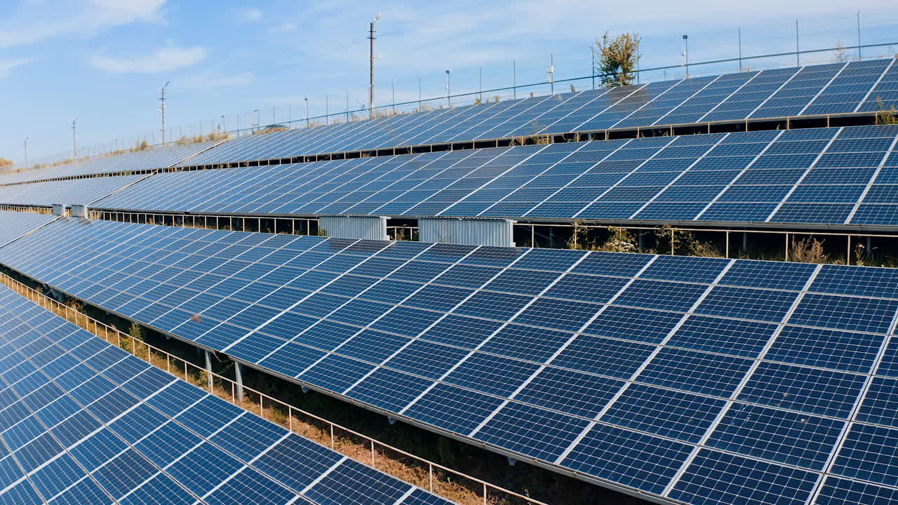 Modern constructions of sunny batteries. Blue photovoltaic solar panels get clean energy from the sun. Alternative source of eco energy.