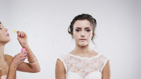 bridesmaid blowing bubbles slow motion wedding photo booth series