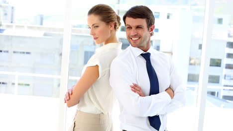 smiling business team standing back-to-back