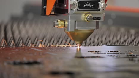 CNC-Laser-cutting-of-metal,-modern-industrial-technology.-Small-depth-of-field.-Warning---authentic-shooting-in-challenging-conditions.