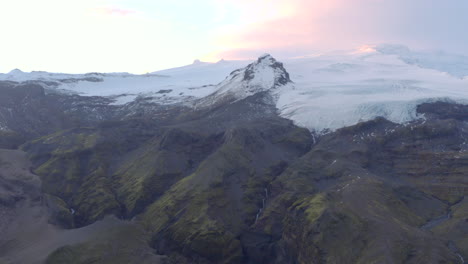 Aerial-shot-over-mountain-top-glacier-Iceland