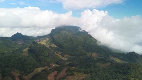 doi nang high altitude impressive mountain ridge with remote farmland in northern thailand covered in clouds, ban nong kha tae, chiang dao, chiang mai