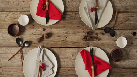 video of plates with cutlery and glasses on wooden surface