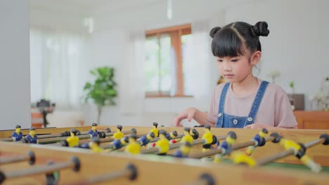 child playing foosball at home