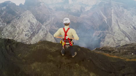 an excellent aerial over the cape verde volcano with an explorer watching over the rim