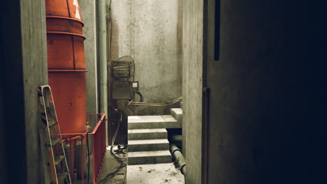 grungy abandoned industrial corridor with stairs and rusty pipes