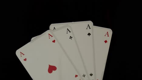 four playing cards  are burned