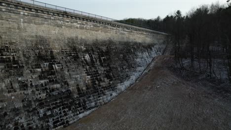 An-aerial-view-of-a-reservoir-wall-on-a-cloudy-evening