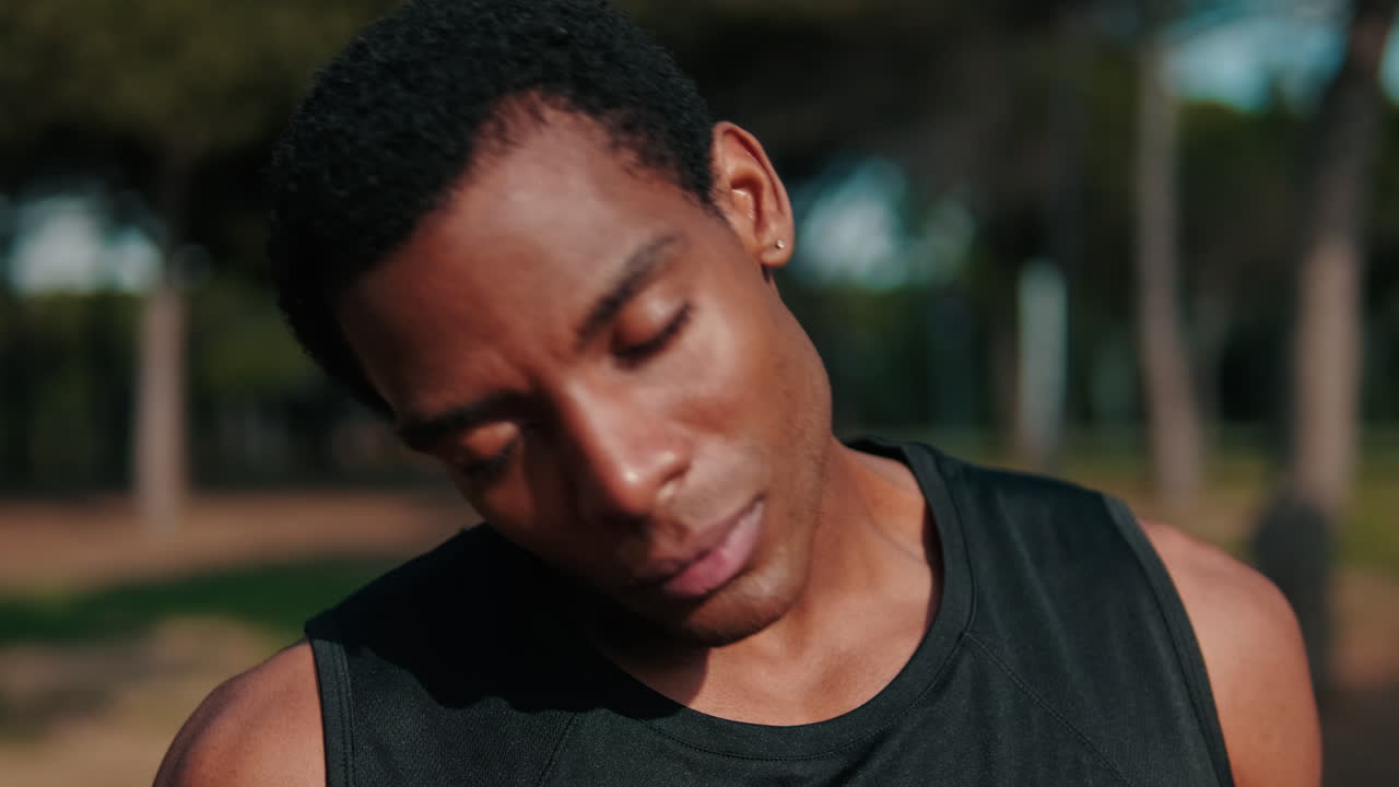 Young Man Stretching in the Park