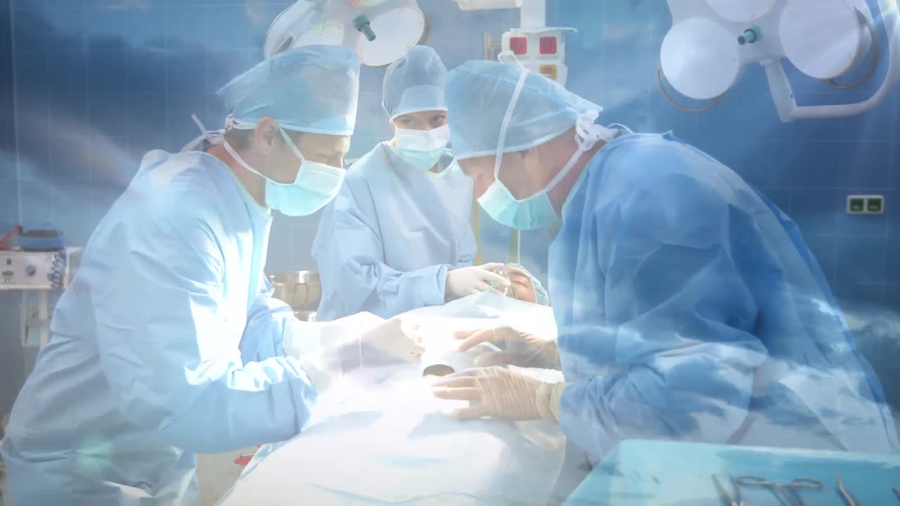 하늘의 구름에 대항하여 병원에서 수술을 수행하는 외과 의사 팀의 디지털 구성
