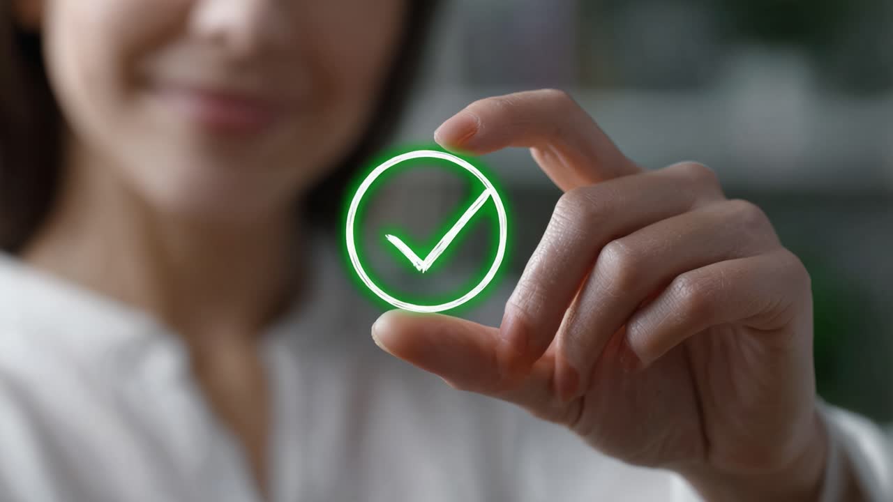 A woman holding a glowing green checkmark symbol, conveying approval and positivity, demonstrating confidence and achievement in a bright, modern setting