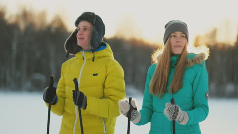 family skiers spend the weekend together doing skiing in the woods. healthy lifestyle. slow motion. loving couple