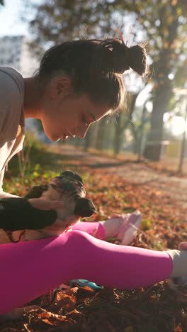 girl and puppy in autumn park