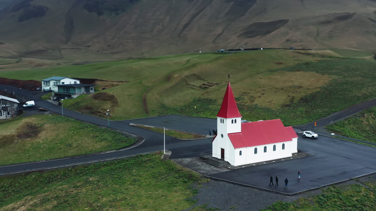 Aerial drone shot of local Church in V&iacute;k &iacute; M&yacute;rdal, South Iceland